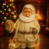 Figura navideña de Papá Noel en blanco y dorado con regalo